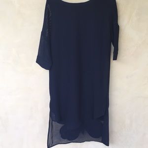 Black mesh dress with a butterfly detail on hem